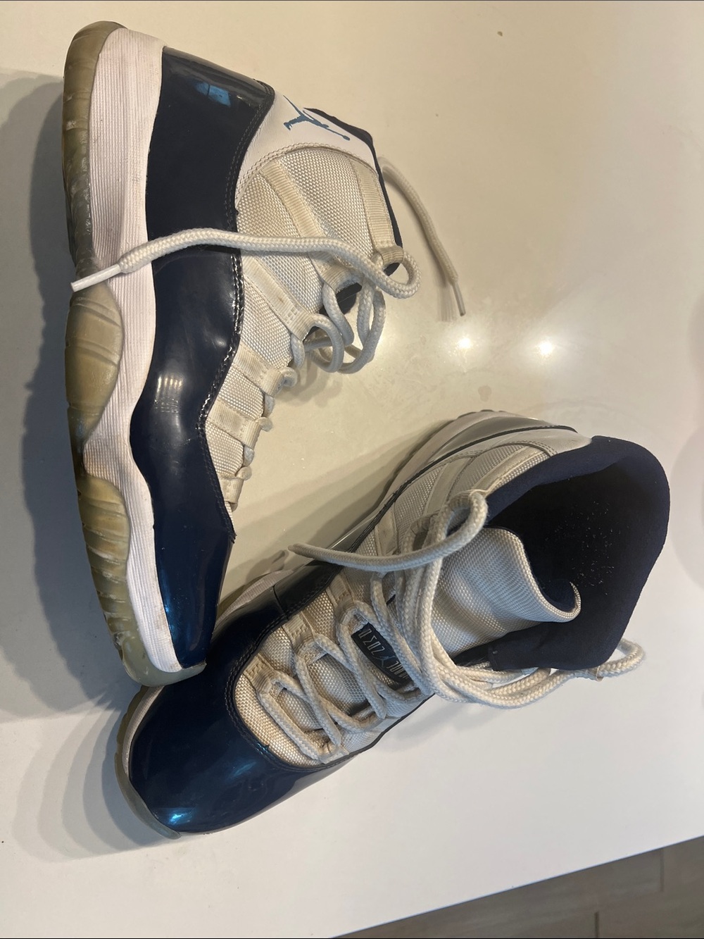 Jordan 11 White and Navy High-Top Sneakers